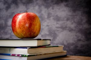 school books and apple